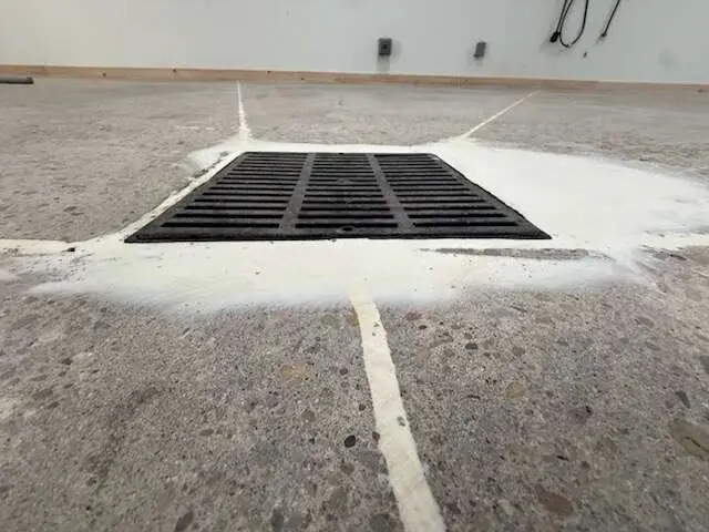 Before: Drain Surround, Cut Clean, the bare concrete